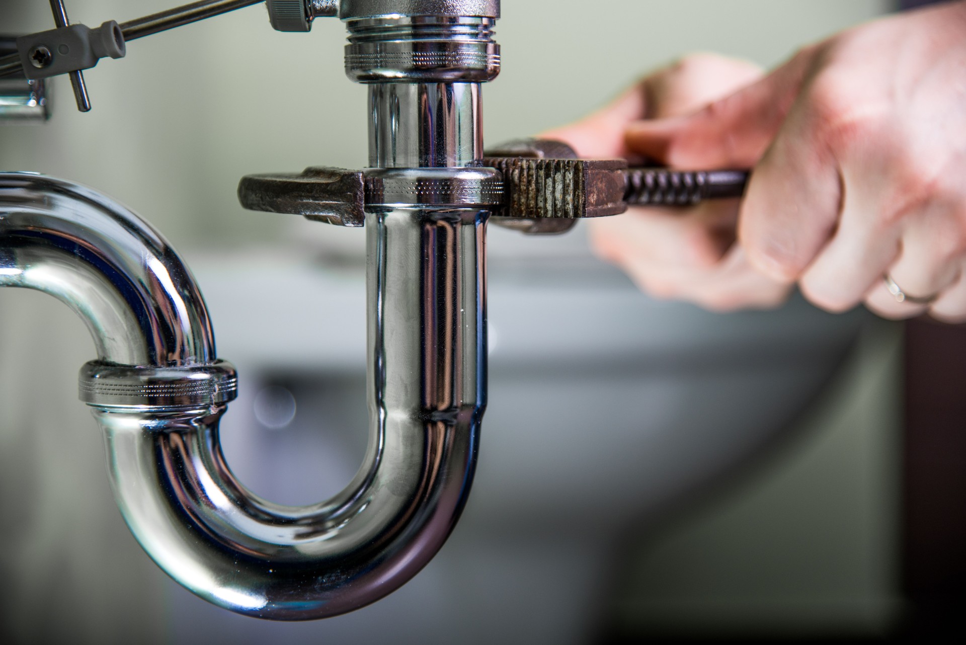 Plumber fixing a drain problem